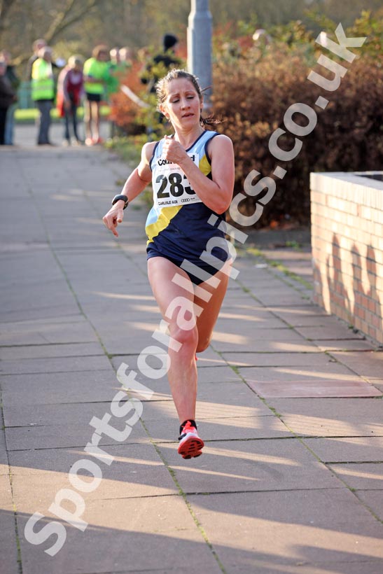 Claire Simpson (Chester-le-Street) finising 2nd in the Brampton to Carlisle 10 mile.